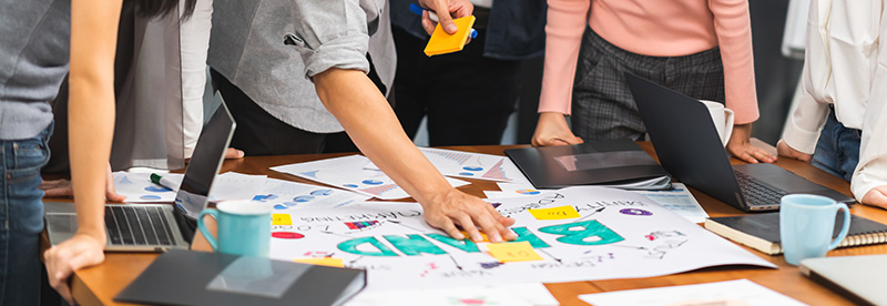 Marketers collaborating at a table