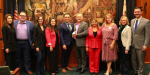 Counterintuity CEO Lee Wochner accepting the award with the Burbank Chamber members and special guests