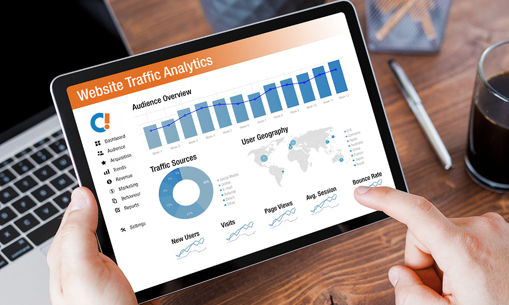 marketer viewing website traffic analytics on a tablet