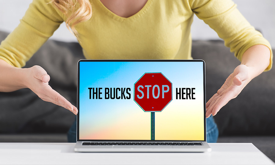 Frustrated marketer with The Bucks Stop Here on their laptop